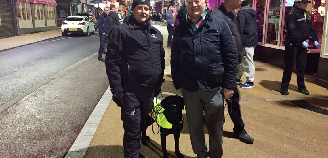 Dog handler Simon and drug dog 'Moss' with Leicestershire Police & Crime Commissioner, Lord Willy Bach